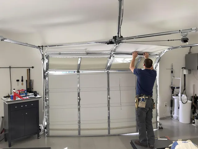 Westport Garage Door Repair specialist performing precise section replacement on Westport garage door